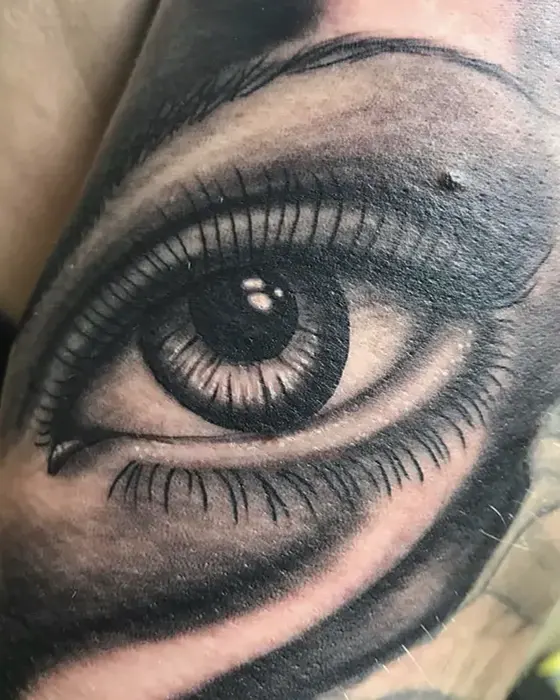 black and grey eye tattoo
