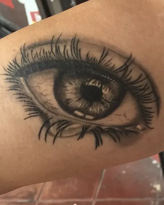 black and grey realistic eye tattoo