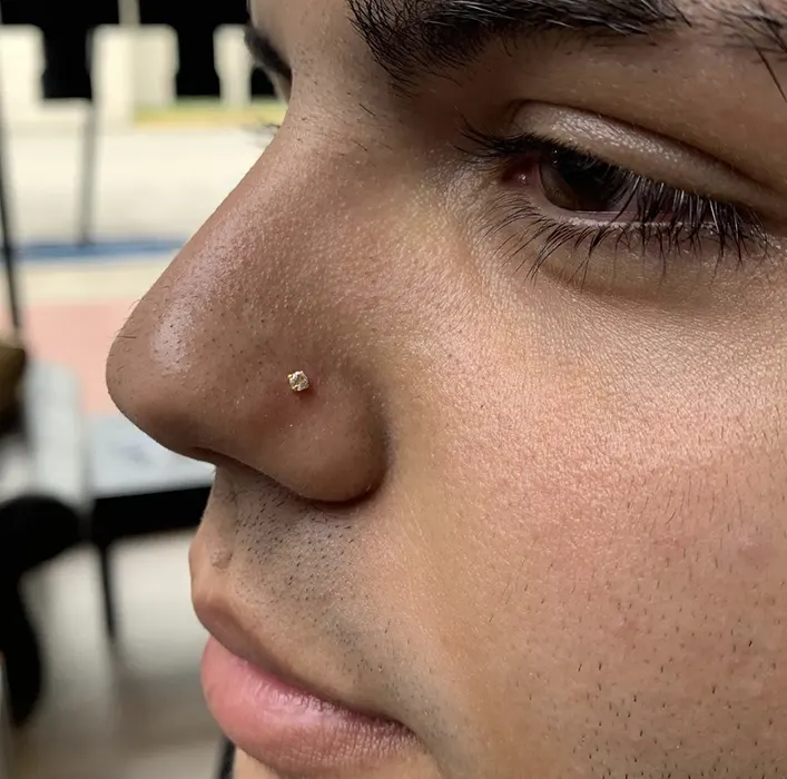 gold nose piercing